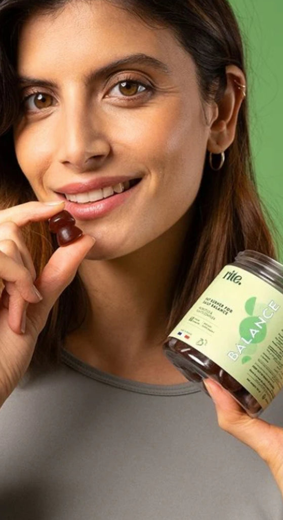 BALANCE VITAMIN GUMMIES bottle with woman holding gummy, natural DAILY HORMONE SUPPORT GUMMIES supplement