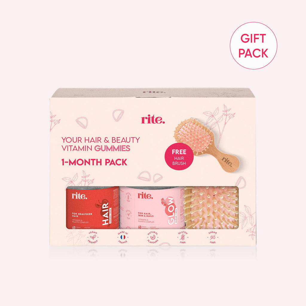A pbox with text that says "rite. YOUR HAIR & BEAUTY VITAMIN GUMMIES 1-MONTH PACK GIFT PACK FREE HAIR BRUSH.