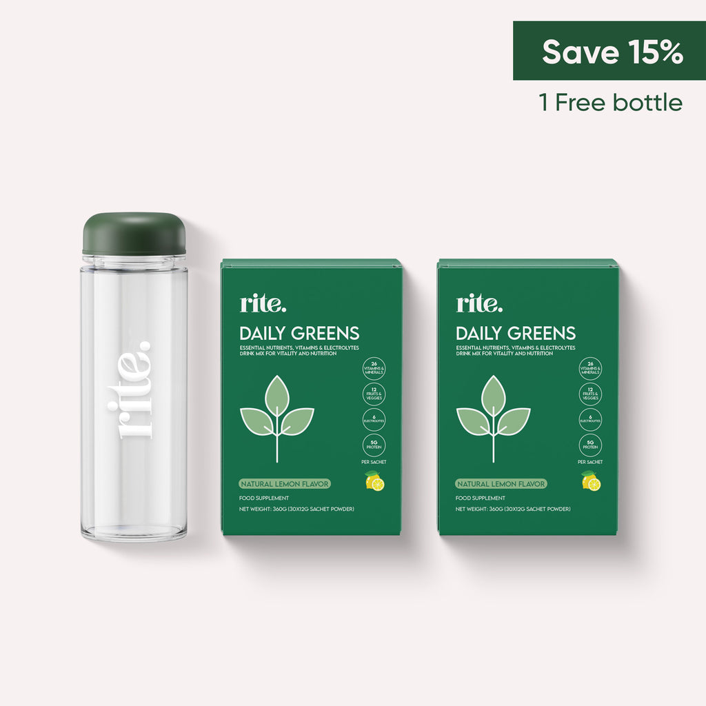 A green bottle and two green boxes of Rite Daily Greens with lemon flavor on a white background. The boxes have a "Save 15% and 1 Free Bottle" offer.