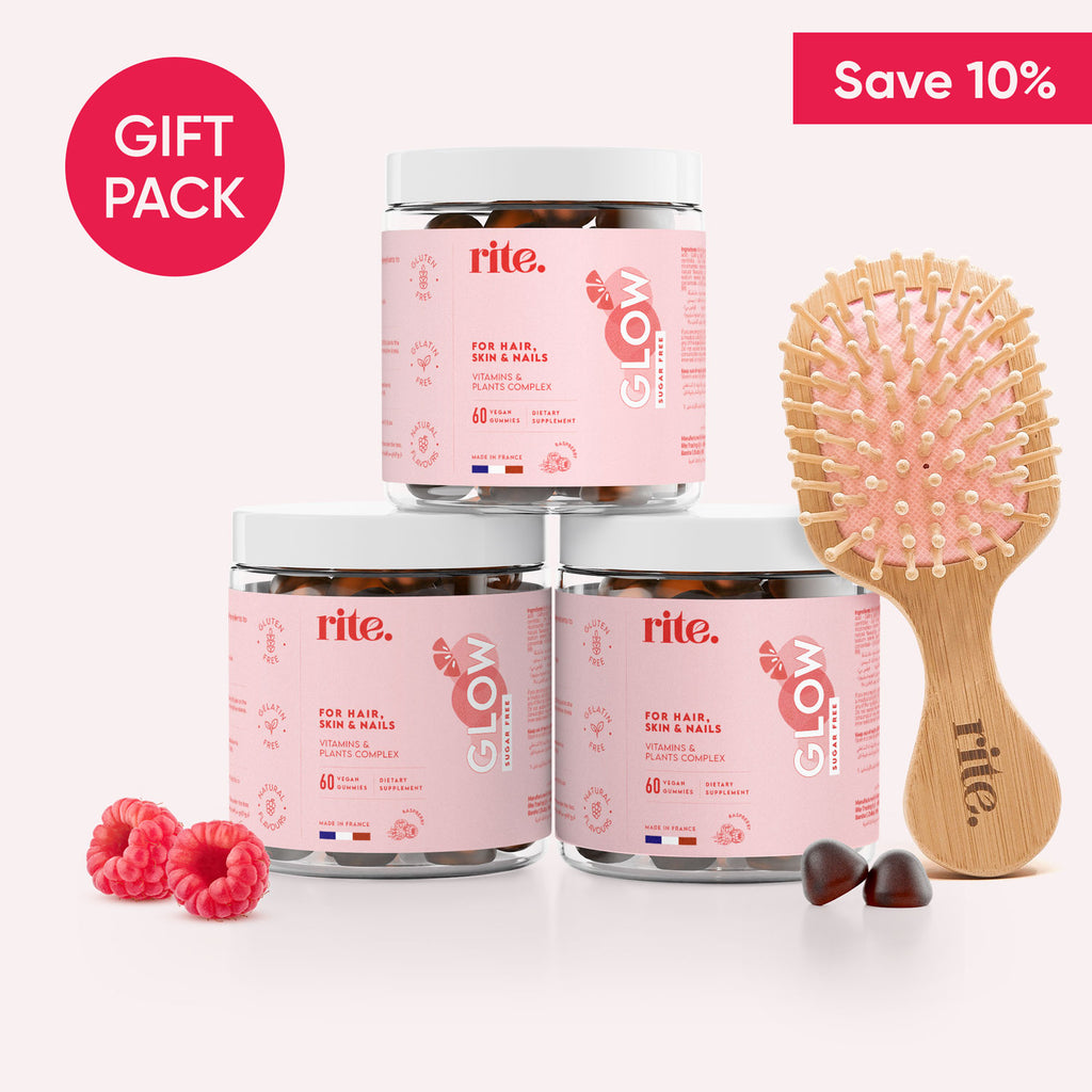 Three jars of Rite GLOW gummies and a hairbrush on a white background.Text on the box says "Save 10%” and "Gift Pack".