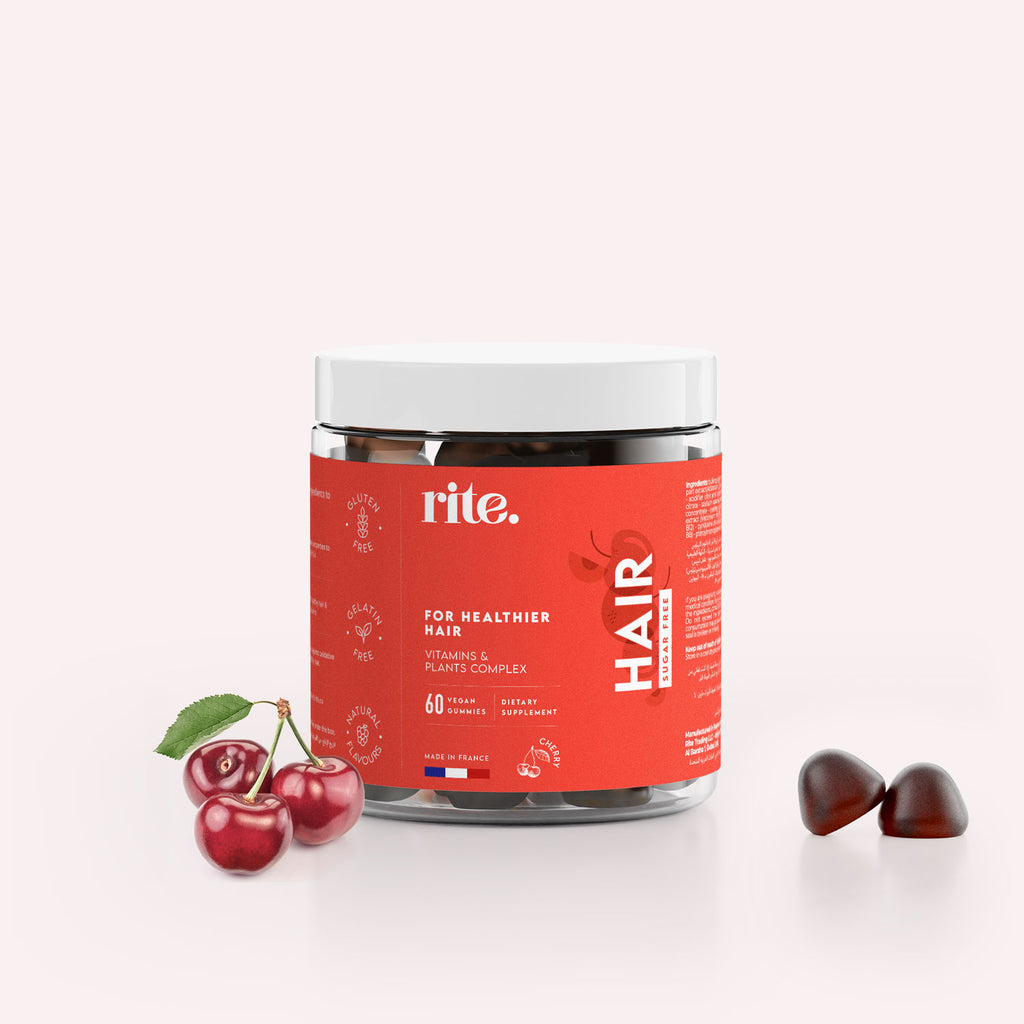 A jar of  Rite Immunity Multivitamin Gummies sits next to a cherry.