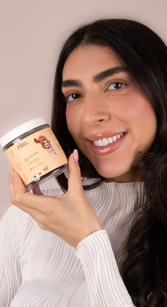 SKIN GUMMIES jar with peach-toned label containing biotin, zinc, and vitamin C for healthy skin and natural glow.