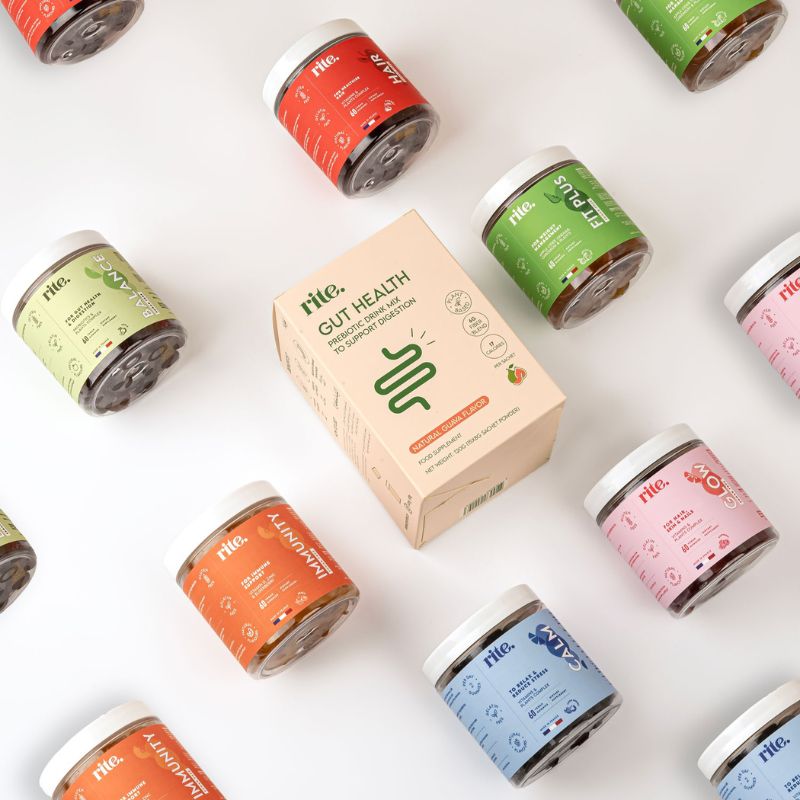 Assorted Rite WELLNESS GUMMIES surrounding a GUT HEALTH box supplement, designed for digestion and balanced nutrition.