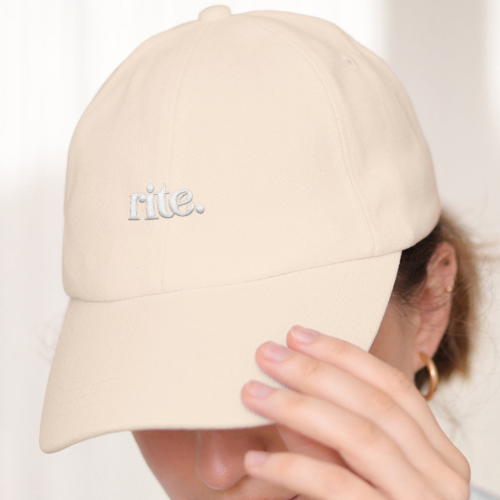 WHITE RITE CAP, soft cotton build with subtle embroidered branding—perfect for daily wear and effortless style.