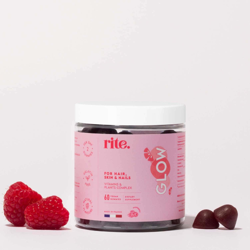 Pink-labeled jar of RITE. GLOW GUMMIES for hair, skin & nails, with raspberries and two gummies beside the jar.