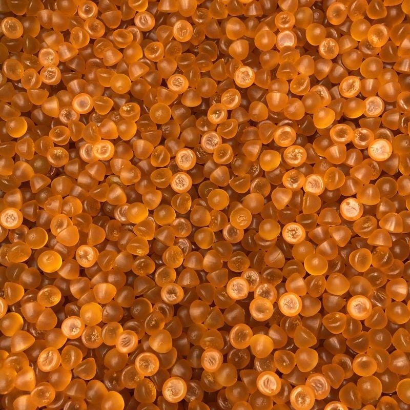 Close-up of pile of orange energy gummies.